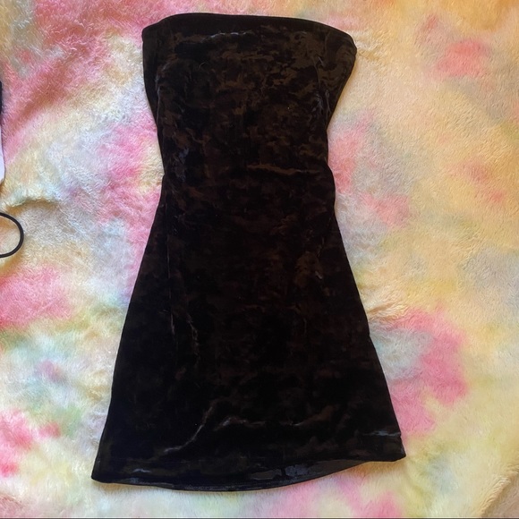 Very short and tight strapless mini dress.